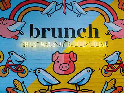 Painted wall at Early Bird that says "Brunch, this was a good idea."